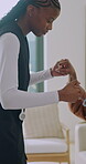 Hands, help and nurse lifting old person for physical therapy, walking and exercise in house. Senior woman, caregiver and support or patient assistance, balance steps and healthcare for wellness