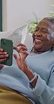 Phone, scroll and old woman on couch with laugh, internet and retirement joke on social media post. Happy, senior black person and relax in home with tech, browsing website and humor for online meme.