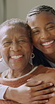 Support, caregiver or old woman on sofa with face, connection or security embrace in assisted living. Black people, nurse and elderly person with hug, happy relationship and trust in retirement home.