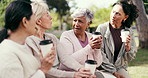 Women, friends and chat in park with coffee, fitness tips and relax with gossip story for bonding. Mature people, walking group and outdoor with drink for break, discussion and sharing wellness ideas
