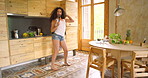 Woman, energy and dancing while cooking in kitchen, music and crazy comedy on weekend at home. Female person, singing and happy for nutrition, diet and food preparation for healthy meal on morning