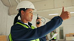 Woman, radio or thumbs up on construction site for planning, project management or safety regulation. Team supervisor, tech and gesture at worksite for renovation instruction for engineering approval