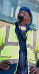 Construction, man or happy with site inspection for compliance, progress or structural integrity. Electrician, black person or phase assessment with renovation approval, quality control or pride