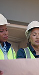 Construction, team and blueprint with building inspection, phase evaluation and structural safety. People, architect or foreman with floor plan for code compliance, renovation progress or regulations