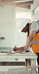 Construction, blueprint and man on site with draft, project sketch and architect layout for renovation. Building, engineer or supervisor with writing, floor plan and operation report for remodeling.

