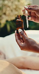 Hands, woman and dropper at spa with serum, massage and aromatherapy for hydration treatment. Masseuse, customer and bottle at salon with essential oil, natural ingredients and skincare for wellness