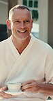 Spa, discussion and senior man with coffee, retirement and chilling with warm beverage on vacation. Resort, guest and retired person with tea, happy and conversation with drink on holiday and break