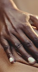 Hands, woman and massage at spa with lotion, exfoliation and hydration treatment for smooth skin. Masseuse, person and body scrub at salon for skincare, natural ingredients and detox for wellness