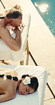 Spa, above and couple with hot stones for stress relief, massage and treatment for anniversary. Marriage, pool and mature man and woman with heat therapy, pamper and wellness to relax at resort