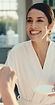Coffee, cheers and happy woman in spa, celebration and conversation with warm beverage on vacation. Resort, guest and mature person with tea on holiday, toast and discussion with caffeine drink