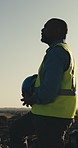 Construction, thinking and man with helmet in city for planning, reflection and civil engineering. Architecture, idea and worker with ppe for safety compliance, remodeling and property development