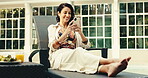 Woman, laugh and texting with phone, holiday or communication with contact on social media at hotel. Reading, funny message and mature person with mobile on vacation, happy and chatting on website