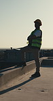 Construction worker, outdoor and man with arms crossed, thinking and pride for property development. Space, reflection and confident on roof, site inspection and planning for building renovation