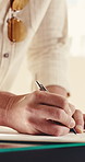 Person, hands and writing with document for registration, signing or checkin on reception desk. Customer, signature and filling in form with paperwork for application or attendance in hotel retreat