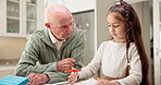 Coloring, homework and child with grandpa in kitchen, skill development or creative project in home. Senior man, talk and kid with assignment, family bonding and cognitive growth with crayon in house