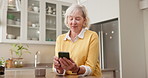 Texting, smile and senior woman with phone, kitchen and communication with contact on social media. Typing, message and happy old person with mobile, internet connection and chatting on web in house
