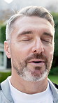 Man, breathe and meditation outdoor for yoga, holistic balance and spiritual healing with chakra. Thinking, mature person or exhale in backyard for inner peace, fresh air and technique of mindfulness