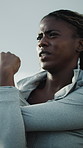 Athlete, woman and stretching outdoor for fitness, start exercise and getting ready for training. African person, breathing and warm up in city for preparation, endurance workout and sports activity