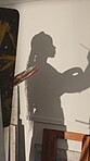 Art, palette and woman painting in shadow with color, space and creativity with craft easel. Studio, female person and professional artist or painter with process, project and paintbrush by canvas