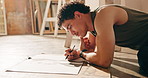 Sketching, project or college student in studio with thinking, learning or inspiration in art practice. Perspective, floor or man with drawing, craft reflection or creative development in university.