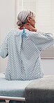 Hospital, neck pain and sick old woman on bed with stretching, arthritis disease or injury. Back, senior person or patient with medical insurance, healthcare or treatment in gown for physical strain