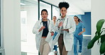 Running, emergency and medical team in hospital with tech, paperwork and watch for urgent task. Women, nurses and doctors rush in clinic for paging, device alert or time for healthcare or support