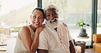 Love, face and interracial couple in home with hug, comfort or bonding together with connection. Tender, smile or mature people with security, happy moment or partner embrace in romantic relationship