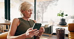 Woman, banking and credit card with phone in home for online shopping or wireless transaction. Happy, mature or female person with smile or debit on smartphone for payment app or ecommerce in house