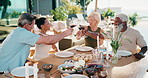 Friends, toast and lunch on patio with wine, summer holiday and celebration for reunion on weekend. Happy, mature people and cheers outdoor in backyard with alcohol drink, food and social gathering.