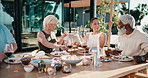 Friends, relax and charcuterie board on patio with wine, summer holiday and reunion on weekend break. Happy, mature people and food platter outdoor in backyard with drink, hangout or social gathering
