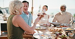 Woman, friends and toast on patio with wine, lunch meal and celebration for summer holiday together. Happy, mature people and cheers outdoor in backyard with alcohol drink, food or relax on vacation.