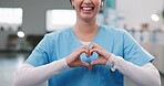 Nurse, woman and happy in clinic with heart hands, healthcare positivity or passion for nursing. Professional, worker or love emoji in hospital for service dedication, medical support or patient care