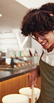 Headphones, cleaning and happy with waiter in cafe for hospitality, dancing and small business. Music, hygiene and barista with person in coffee shop for cleaner, server and streaming service