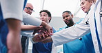 People, doctor or meeting with hands together in hospital for winning, achievement or success. Low angle, medical team or piling with smile, applause or collaboration for healthcare mission in clinic