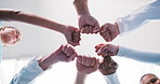 Doctor, unity and medical team with fist bump for collaboration, agreement or partnership. Low angle, people or healthcare community with hands together for solidarity, mission or support in hospital