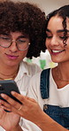 Couple, laugh and talk in coffee shop with phone, browsing or bonding with funny social media post. People, relax and conversation in cafe with tech, internet meme and humor with happy relationship.