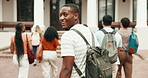 Campus, walking and face of man at college for study opportunity, learning and smile outdoor. University, portrait and happy person with students for education, development and travel to lesson