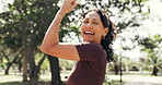 Woman, face and flexing or fitness in park with happiness, health and wellness with muscle outdoor. Mature, person and champion with strong bicep, laughing and portrait for exercise lifestyle