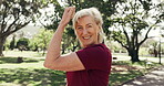 Woman, face and flexing for exercise in park with happiness, health and wellness with muscle outdoor. Mature, happy person and champion with strong bicep, laughing and portrait for fitness lifestyle