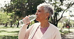 Thinking, water or woman in park with fitness, training reflection or pause in wellness activity. Hydration, rest or mature person with h2o bottle, workout perspective or recovery with outdoor hobby.