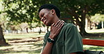 Tired, nurse and student in healthcare with neck pain, higher education and break outdoor on bench. Black man, stress and muscle inflammation in park with problem, ache or fatigue from medical course