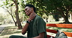 Exhausted, nurse and student in healthcare with neck pain, college stress and break outdoor on bench. Tired, black man and muscle ache in park with problem, education and fatigue from medical study.