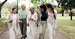 Fitness, instructor or friends in park with walk, wellness session or connection in workout hobby. Talking, coach or mature people with happy moment, exercise group or keeping fit in outdoor activity