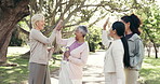 Fitness, friends and high five with old people in park for yoga class, wellness support and lesson. Healing session, achievement and instructor with women outdoor for holistic health and peace