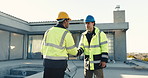 Men, handshake and talking at construction site for feedback, building instruction and welcome. Worker, electrician and shaking hands at worksite for project collaboration, discussion and pointing
