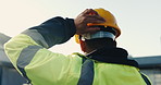 Man, helmet and construction worker at site with safety compliance, protection and injury prevention. Back, person or builder outdoor with PPE for property development project, manual labor and gear.