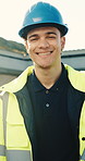 Face, man and electrician at site for construction, inspector and leadership for architecture. Portrait, smile and technician outdoor with helmet, ppe compliance and building supervisor of renovation