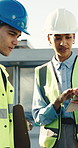 Engineer, team and talk with tablet for construction, research and design approval of architecture. People, review and collaboration at site with tech, client inquiry and survey for building progress