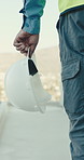 Engineer, helmet and hands at construction site with inspection, safety and man with property review. Engineering, supervisor and person outdoor on rooftop with PPE, building project and evaluation.
