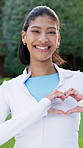 Fitness, face and woman with heart in hands for wellness, exercise and training for cardio health. Happy, portrait and confident person with emoji for fresh air, active hobby and smile for break